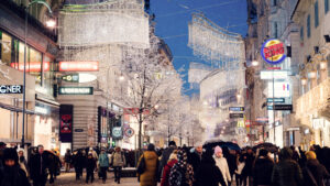 Kärntner Straße in winter with festive lighting and snowflakes.