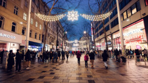 Vienna Mariahilfer Strasse Christmas illuminations featuring holiday string lights festive storefront decorations and seasonal shopping district ambiance.