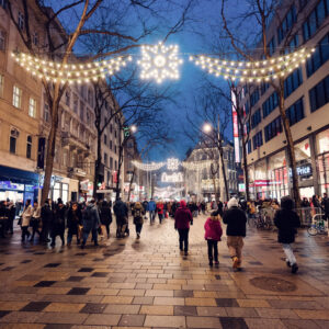 Weihnachtsbeleuchtung auf der Mariahilfer Straße mit Lichterketten und festlicher Dekoration.