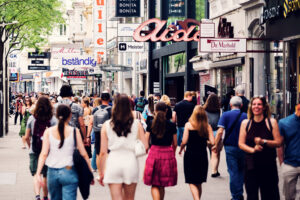Shoppers walking along Mariahilfer Straße in Vienna.