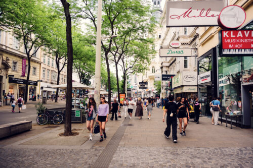 Busy pedestrian zone on Mariahilfer Straße, Vienna’s main shopping street.