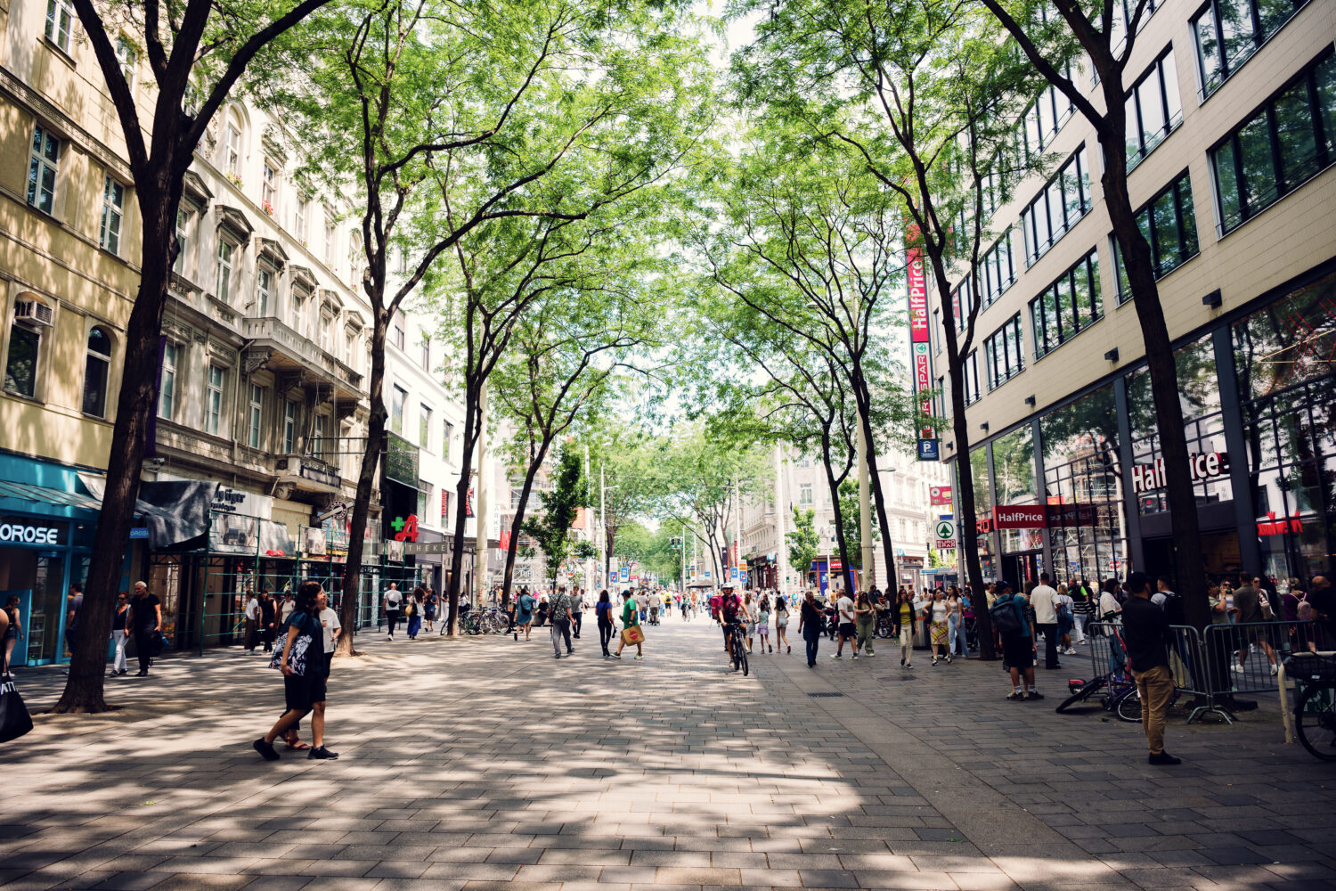Historic buildings and modern shops on Mariahilfer Straße.