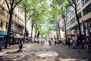 Historic buildings and modern shops on Mariahilfer Straße.