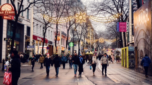 Christmas shopping on Mariahilfer Strasse Vienna showing festive street scene.
