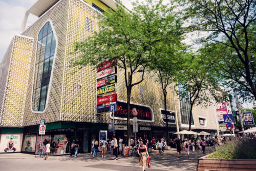 Mariahilfer Straße with international brand stores and boutiques.