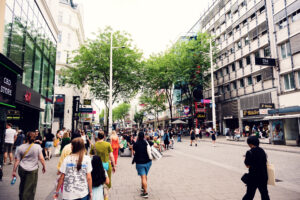 eople walking on Mariahilfer Straße, Vienna’s main shopping street.