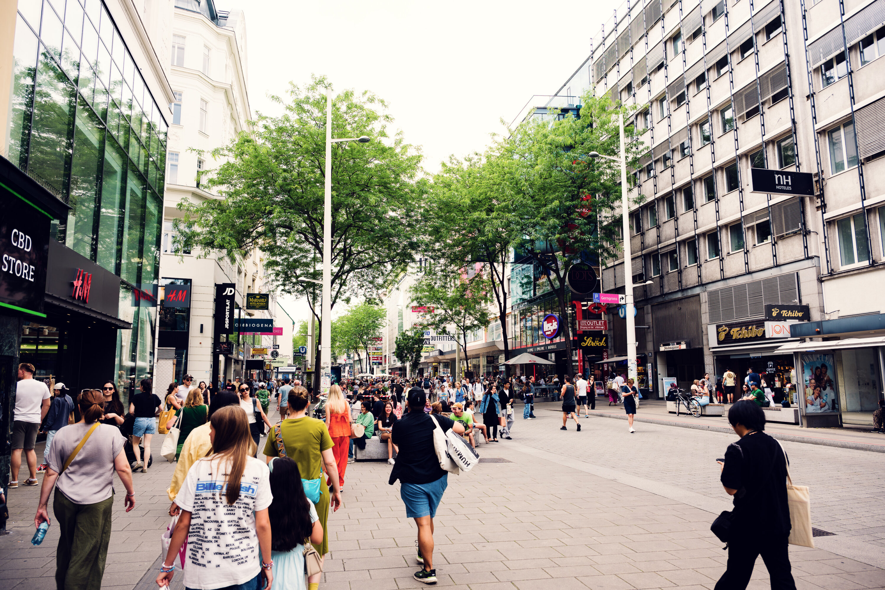 eople walking on Mariahilfer Straße, Vienna’s main shopping street.