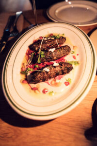 Colorful and flavorful dishes at Neni am Prater, embodying the vibrant food sharing concept.