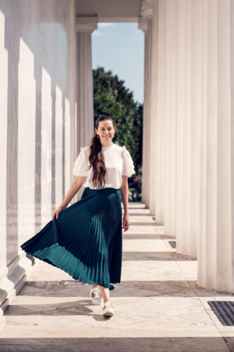 Adriana at Theseustempel Vienna surrounded by classical Greek revival architecture.