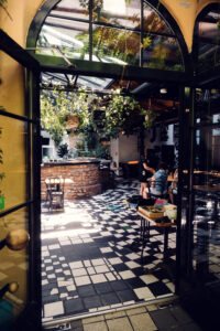 Lush greenery surrounding the tranquil garden space at Café Friedlich.