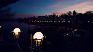 Golden hour at Das Bootshaus with the setting sun reflected in the Alte Donau.