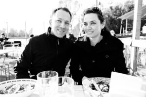 Adriana and Mario seated at the Alte Donau waterfront at Das Bootshaus in Vienna.