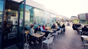Outdoor seating area at Motto am Fluss along the Danube Canal.