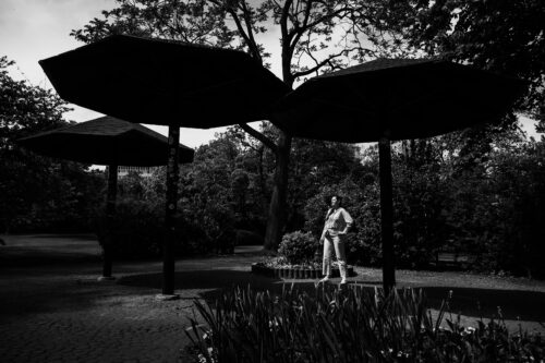 Girl walking along Stadtpark's historic pathways.