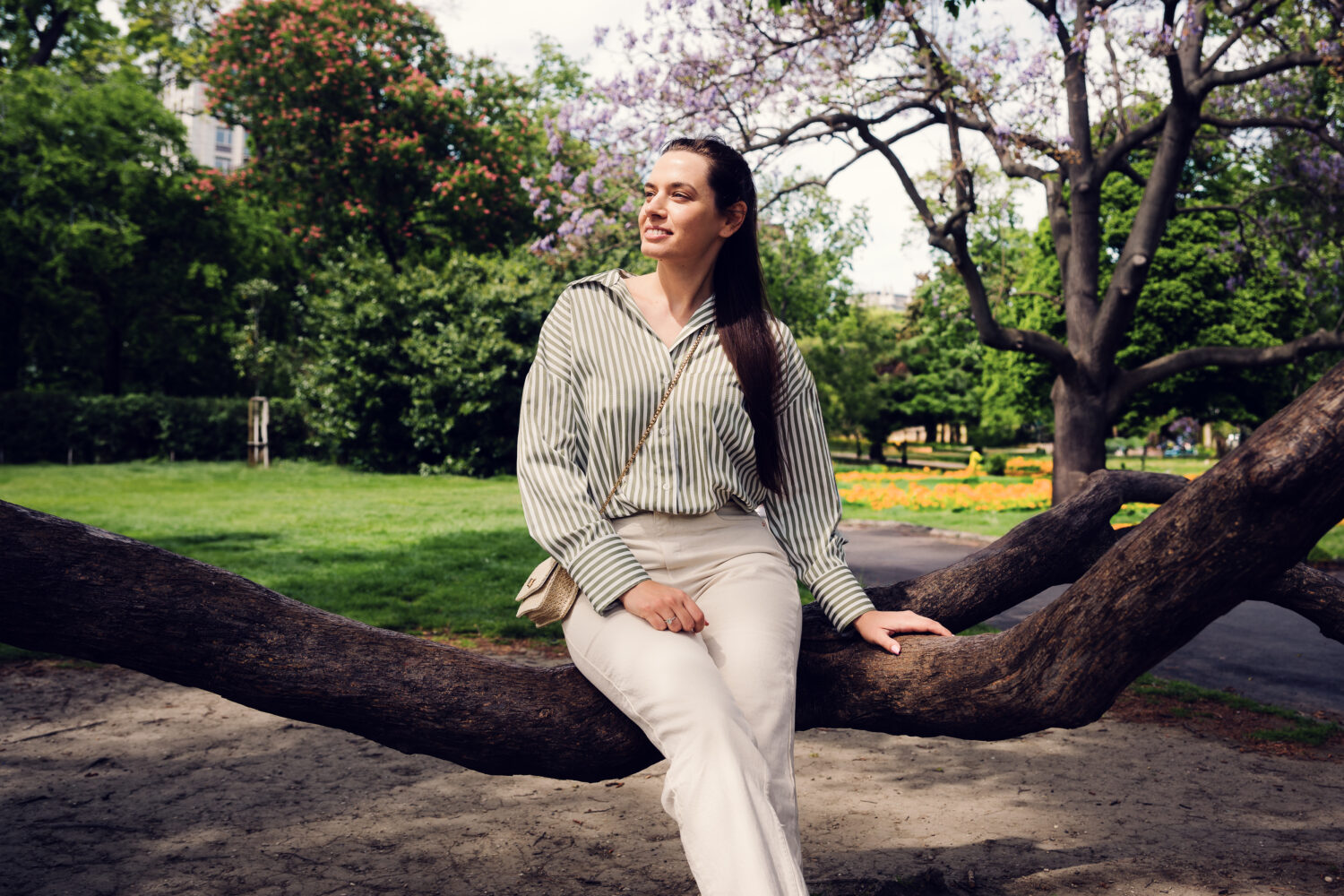 Young woman among Stadtpark's century-old trees.