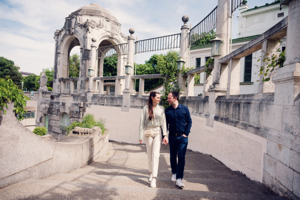 Romantic couple moment at Vienna's Stadtpark, where historic pathways and blooming flowers create perfect photo opportunities.