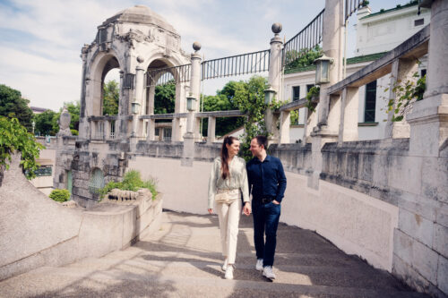 Adriana and Mario at Vienna's Stadtpark, where historic pathways and blooming flowers create perfect photo opportunities.