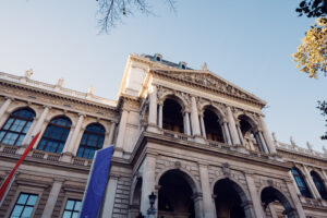 The front of the University of Vienna along the Ringstrasse in soft evening light.