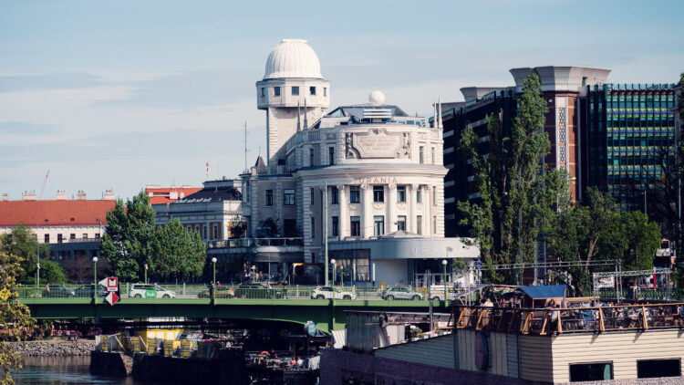 Urania's striking white facade against a bright blue Viennese sky.