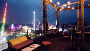 ZOKU's rooftop at twilight, when string lights create a magical atmosphere above Vienna's rooftops.