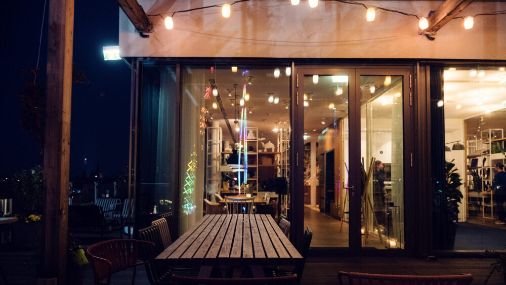 Stunning rooftop terrace at ZOKU Vienna offering panoramic city views.