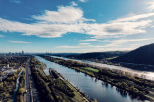 Wide view of the Donauinsel with the New Danube and green banks.