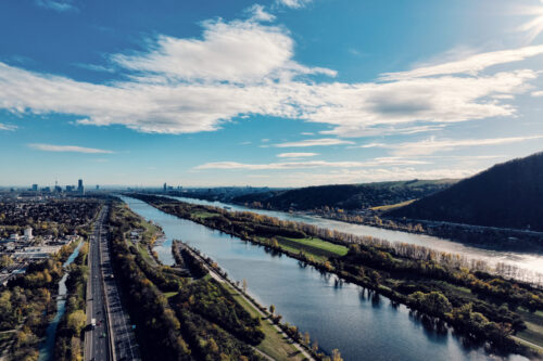 Wide view of the Donauinsel with the New Danube and green banks.