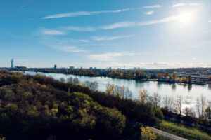 Cycling path along the Donauinsel with riders in the distance.