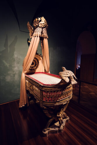 Magnificent ceremonial cradle of Napoleon's son at Vienna's Imperial Treasury, an extraordinary example of French Empire style craftsmanship from 1811.