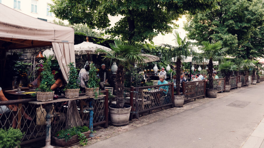 Day scene at Lucullus Terrace Vienna with bright outdoor dining space.