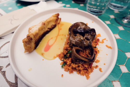 Modern culinary presentation at Lucullus Vienna restaurant with contemporary plating techniques and artistic food arrangement.