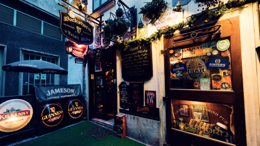 Detail of historic pub signs and vintage advertisements at Bockshorn Vienna.