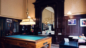 Original billiard room at Café Sperl displaying preserved 1880s interior with historic tables.