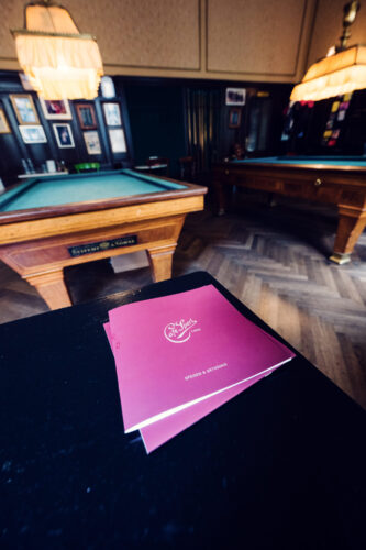 Traditional menu card at Café Sperl displaying classic Viennese coffee house offerings and house specialties.