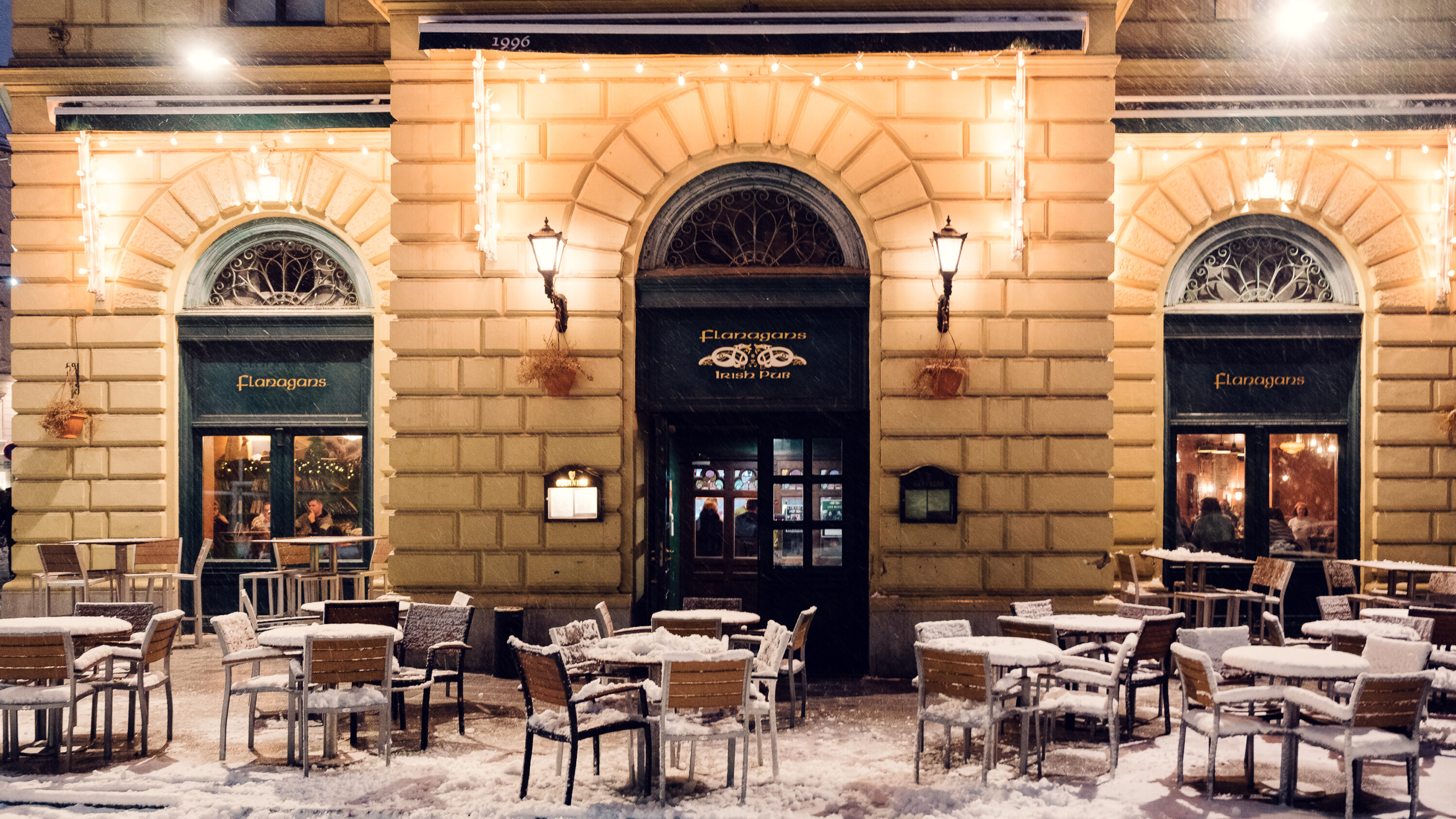 Snow-covered entrance at Flanagan's Irish Pub.