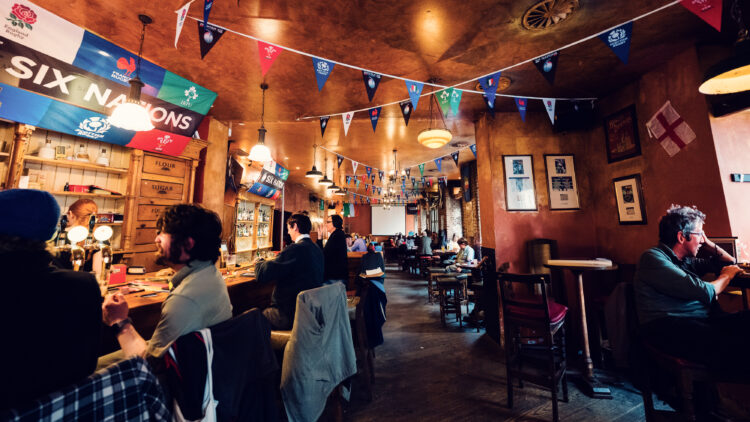 Flanagan's creates authentic sports viewing experience with dedicated viewing areas and proper pint service.