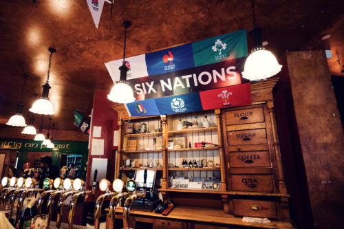 Match day atmosphere at Flanagan's Irish Pub Vienna, where sport fans gather to watch international tournaments on multiple screens.
