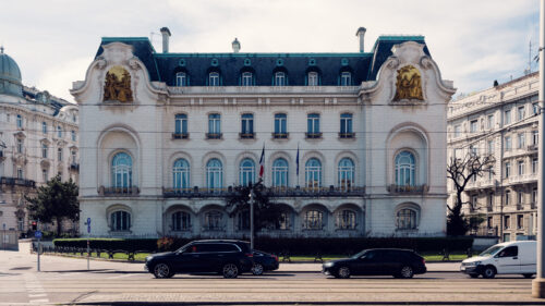 French Embassy in Vienna at the historic Palais Clam-Gallas on Schwarzenbergplatz, a neoclassical building from the 19th century with a French flag on its facade.