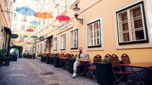 Colorful umbrella alley at Sünnhof with installation over the historic passage.