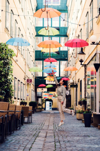 Fashion photography setting under Sünnhof's umbrella art installation.
