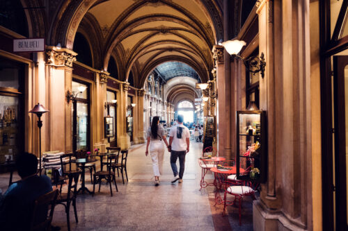 Andriana and Mario at Ferstl Passage Vienna with classical Viennese design elements.