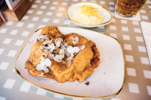 Wiener Schnitzel with truffle served at Lugeck Figlmüller restaurant Vienna.