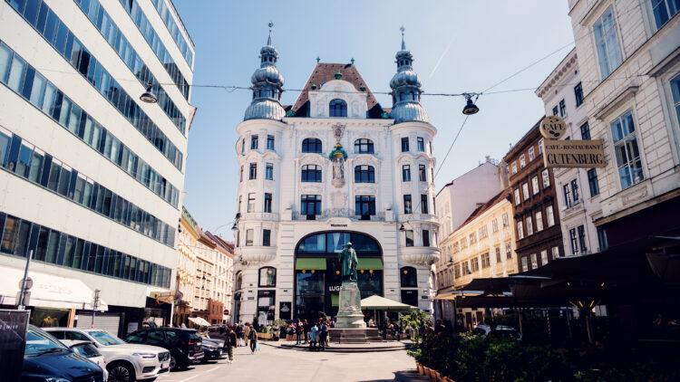 Street view of Lugeck Vienna restaurant exterior, historic Viennese building architecture with traditional restaurant facade and outdoor dining setup in city center.