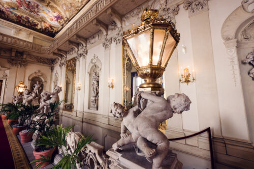 Palais Kinsky Vienna baroque interior marble statues with classical sculptural details.