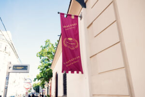 Brewery flag beside the stone doorway at Salm Bräu.
