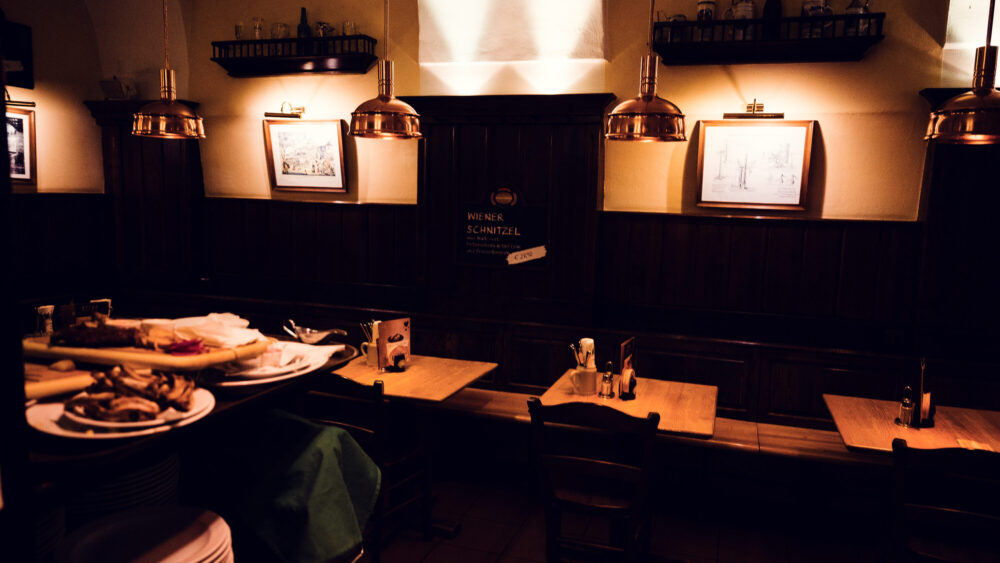 Wiener Salm Bräu interior Vienna with traditional Austrian brewery decor, wooden furnishings and copper brewing equipment, historic Vienna brewery atmosphere.