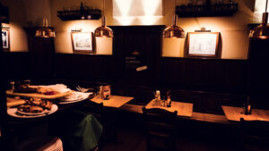 Wooden furnishings and copper brewing equipment in the Salm Bräu tap room.