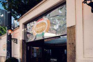Arched entrance doorway to Salm Bräu with the facade above.
