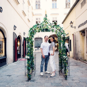 Adriana and Mario exploring hidden alleyways in Vienna's Old Town, narrow cobblestone streets and historic architecture in Inner City.