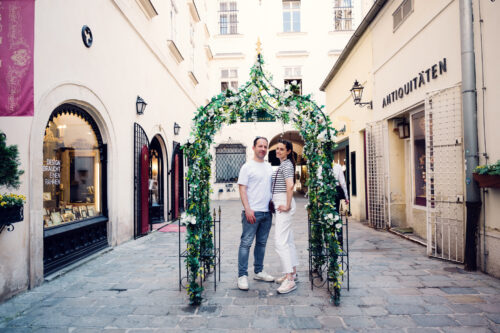 Adriana and Mario exploring hidden alleyways in Vienna's Old Town, narrow cobblestone streets and historic architecture in Inner City.
